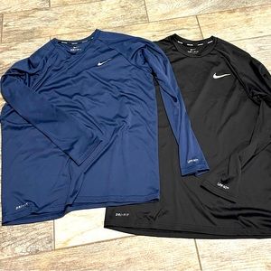 Two Long Sleeve Nike Swim shirts - Like New - Size L